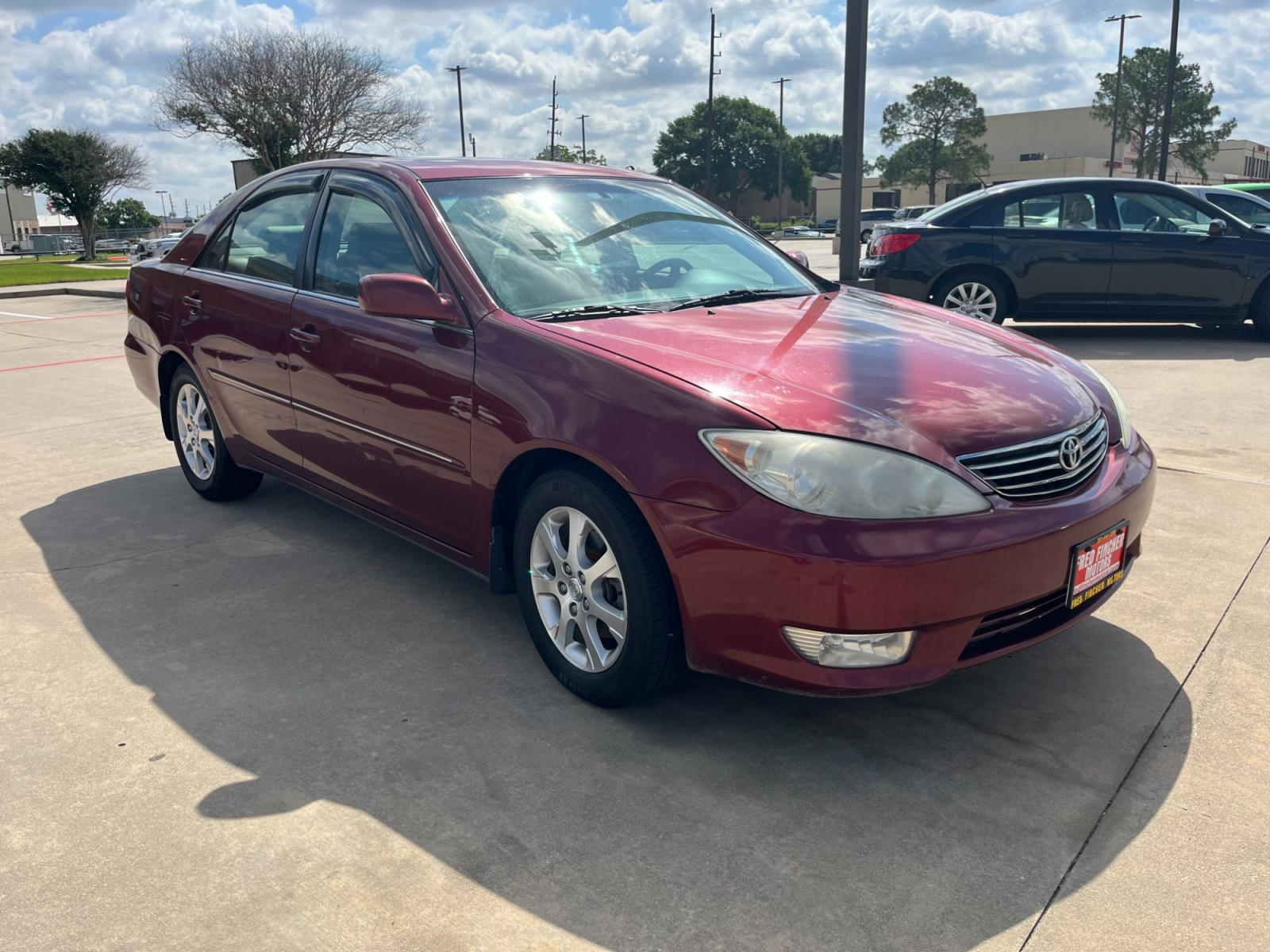 2006 red /TAN Toyota Camry LE V6 (4T1BF30KX6U) with an 3.0L V6 DOHC 24V engine, 5-Speed Automatic Overdrive transmission, located at 14700 Tomball Parkway 249, Houston, TX, 77086, (281) 444-2200, 29.928619, -95.504074 - Photo #0